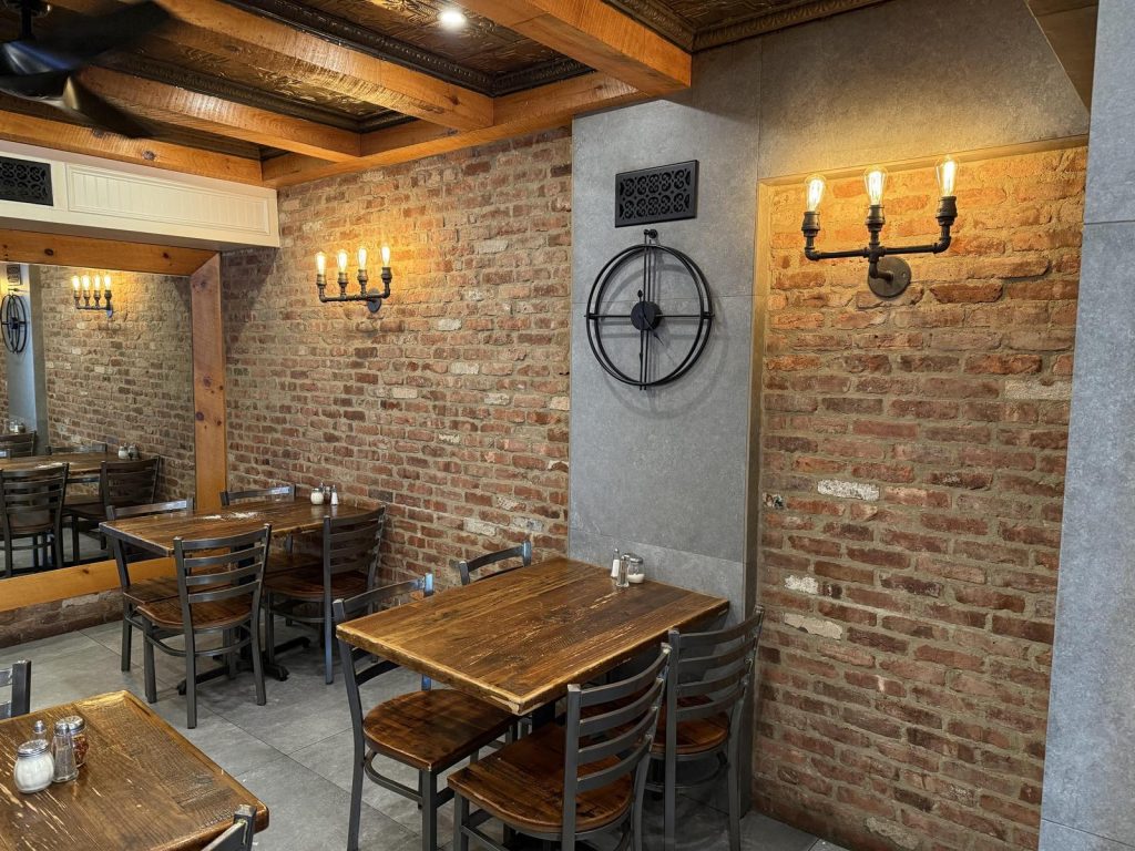 Inside da-Angelo Pizzeria in Albertson — exposed brick and warm lighting